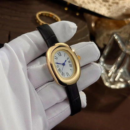 Montre femme ovale vintage dorée bracelet noir
