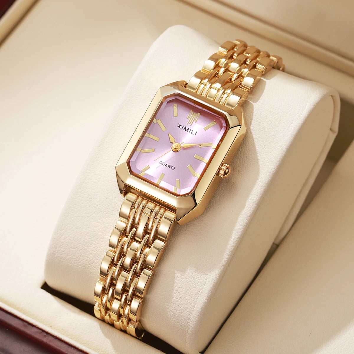 Montre femme rectangulaire dorée cadran rose sans boîte